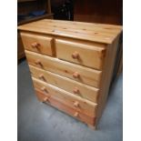 A modern solid pine chest of drawers