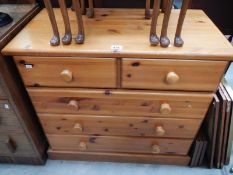 A modern solid pine chest of drawers