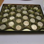 A tray of UK 10p pieces.