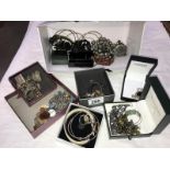 A quantity of assorted costume jewellery including silver ear studs, charm bracelet etc.
