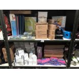 2 shelves of office stationary items including mechanical pencils, hole punches etc.