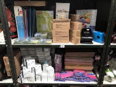 2 shelves of office stationary items including mechanical pencils, hole punches etc.