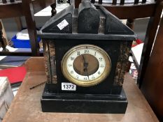 A slat mantel clock for restoration