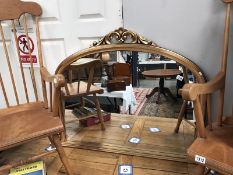 A gilt framed overmantel mirror