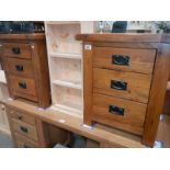 A pair of solid oak 3 drawer bedside chest of drawers