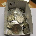 A mixed lot of old coins including some silver.