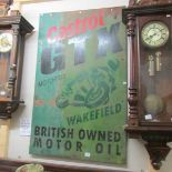 A painted metal advertising sign 'Castrol GTX motor Oil Wakefield British Owned Motor Oil'.