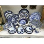 A quantity of blue and white pottery including Spode blue willow etc.