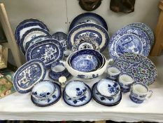 A quantity of blue and white pottery including Spode blue willow etc.