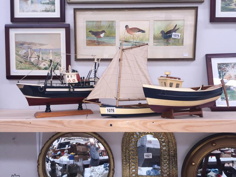 3 wooden models of a fishing trawler,