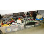 A large box of lego with some partially complete kits,