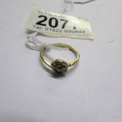 A gold 3 stone diamond ring, marks rubbed, size K.
