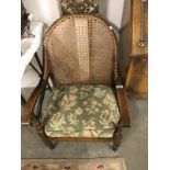 An armchair with bergier back