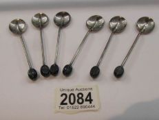 6 silver coffee bean spoons.