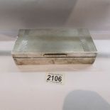 A hall marked silver cigarette box.