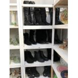 4 shelves of black ladies and men's boots (11 pairs)