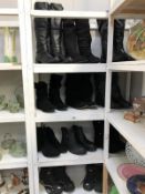 4 shelves of black ladies and men's boots (11 pairs)