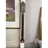 A 19th Century mahogany stick barometer with silvered scale