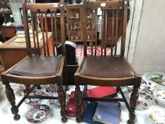 A pair of 1930's oak dining chairs