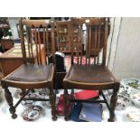 A pair of 1930's oak dining chairs