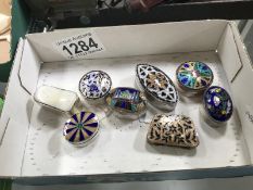 A collection of white metal and enamel pill boxes (not marked possibly silver)