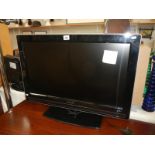 A 32" Philips flat screen TV (remote in office)