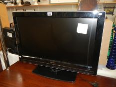 A 32" Philips flat screen TV (remote in office)