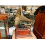 A wind up horn gramophone with brass horn (missing winding handle)