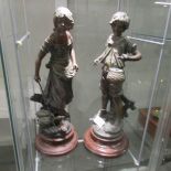 A pair of spelter figures,.