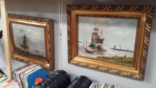 2 gilt framed oil paintings of sailing ships,