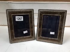 A pair of solid silver photo frames