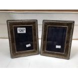 A pair of solid silver photo frames