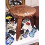 A carved pine stool