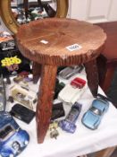 A carved pine stool