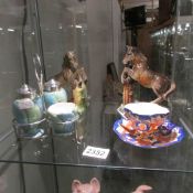 A Royal Winton cruet set, a china cup and saucer and a pair of horse book ends.