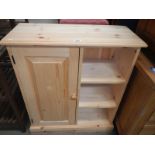 A solid pine cupboard bookcase