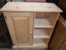 A solid pine cupboard bookcase