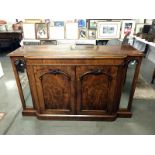 An Edwardian mahogany side board with mirror panels