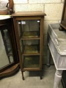 An Edwardian inlaid display cabinet - one glass side panel A/F