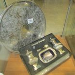 A cased silver plate cruet set and a silver plate tray.