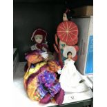 An oriental collectors doll and 3 others