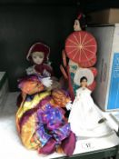 An oriental collectors doll and 3 others