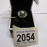 A diamond and emerald cluster ring, circa 1970/1980's, hall marked, size O.