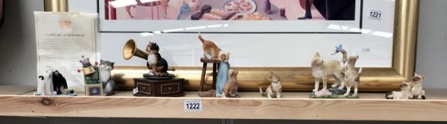 A collection of cat figures including Sherratt & Simpson,
