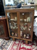 A 1930's oak display cabinet