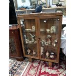 A 1930's oak display cabinet