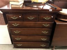 A 5 drawer chest (top drawer having a false 3 drawer front)