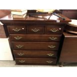 A 5 drawer chest (top drawer having a false 3 drawer front)