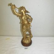 A gilded spelter figure.
