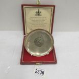 A cased 1977 silver commemorative dish with coin centre.